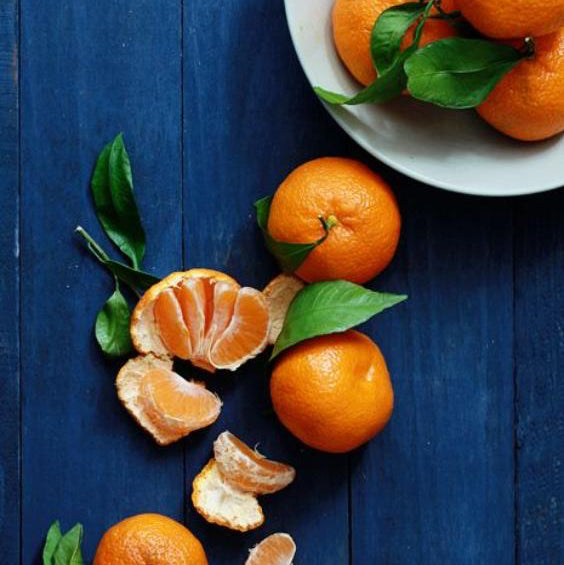 close up of the TOP notes ingredient, MANDARINE which is used in the scented candle MYKONOS