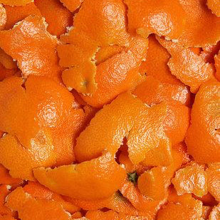 close up of the top notes ingredient, orange zest/peel which is used in the scented candle SAFFRON