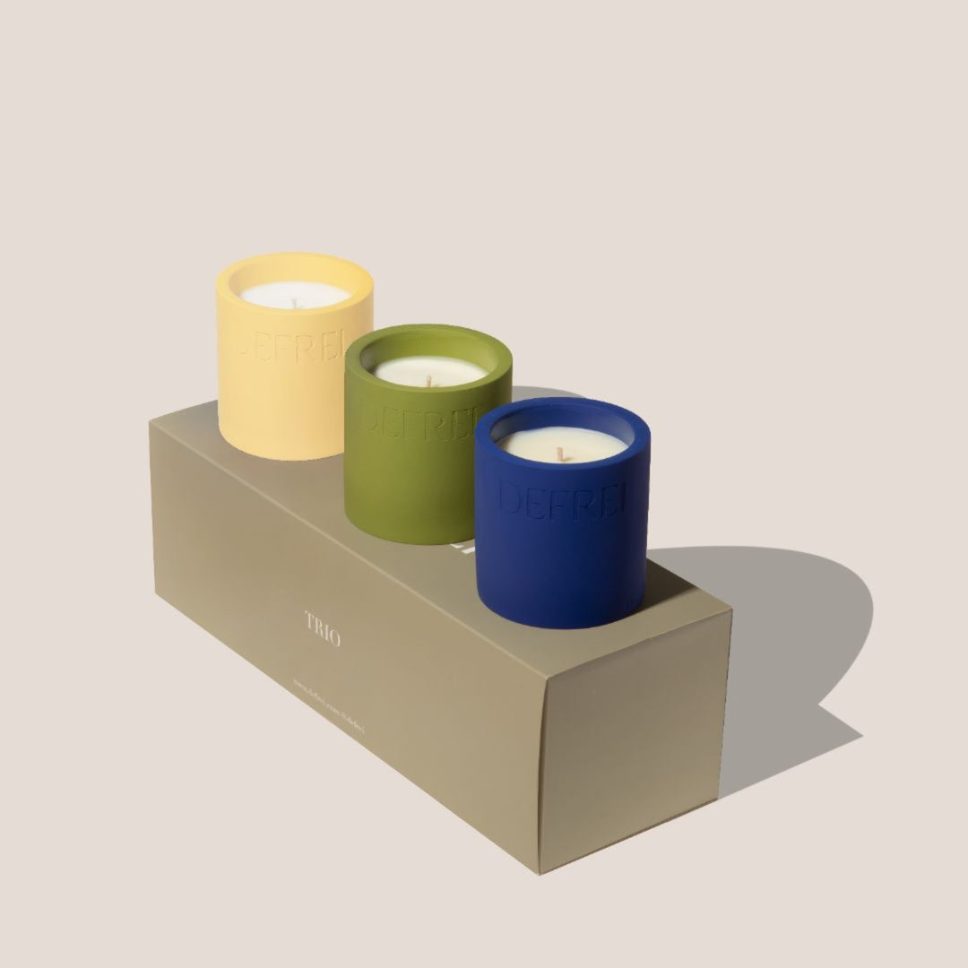 Sustainable packaging trio gift set of scented candles resting on top and next to the TRIO box GIFT SET box showing FIG BEACH MYKONOS