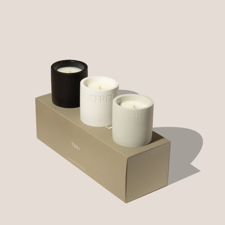 DEFREI_TRIO_GIFT_SET_candle_ ON TOP_close_up_THORNN_BEDSHEETS_OUD