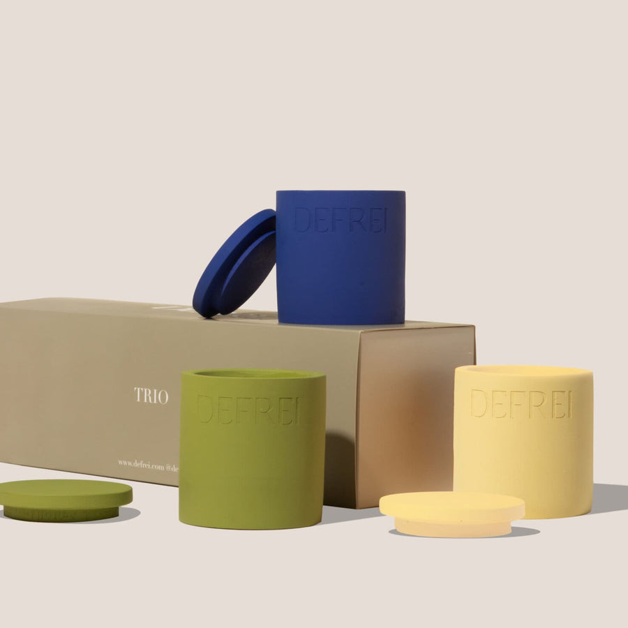 Sustainable packaging trio gift set of scented candles resting on top and next to the TRIO box GIFT SET box showing FIG BEACH MYKONOS